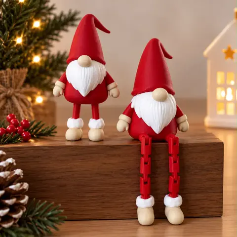 Two red Christmas gnome decorations, one standing and one sitting with dangling legs
